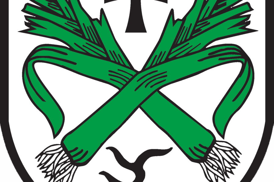 Wappen mit zwei gekreuzten grünen Lauchstangen, schwarzem Kreuz und springendem Hund.