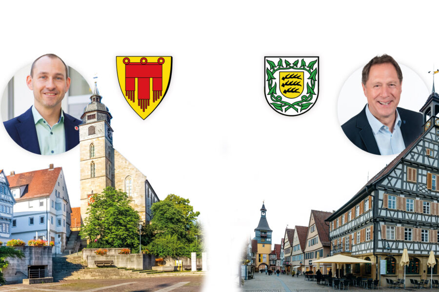 Zwei Männer in Anzügen, zwei Wappen, Fachwerkhäuser und eine Kirche.