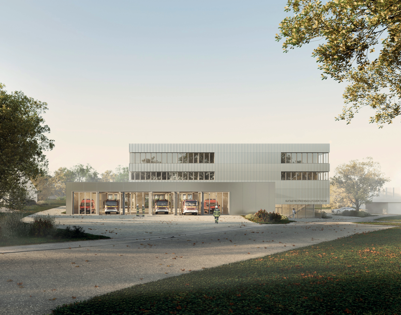 Modernes Gebäude mit zwei Etagen, Feuerwehrfahrzeuge im Erdgeschoss sichtbar.