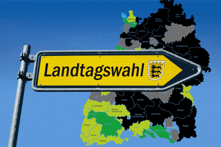 Gelbes Schild mit Schriftzug „Landtagswahl“ vor einer Karte.