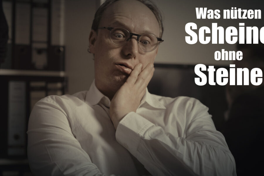 Mann mit Brille stützt Kopf auf Hand; Text: "Was nützen Scheine ohne Steine".