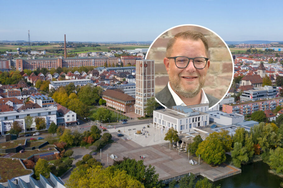 Luftbild einer Stadt mit einem Rathaus und eingekreistes Porträt eines Mannes.